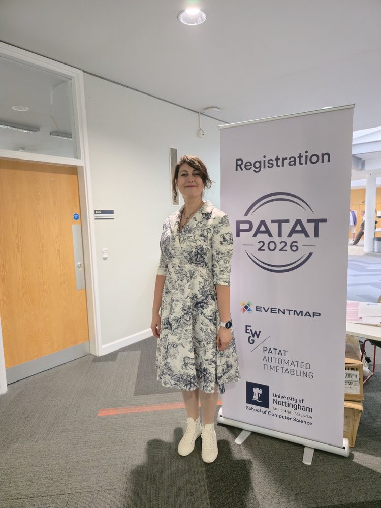 Nilgün Şengöz at the PATAT 2026 registration area, University of Nottingham